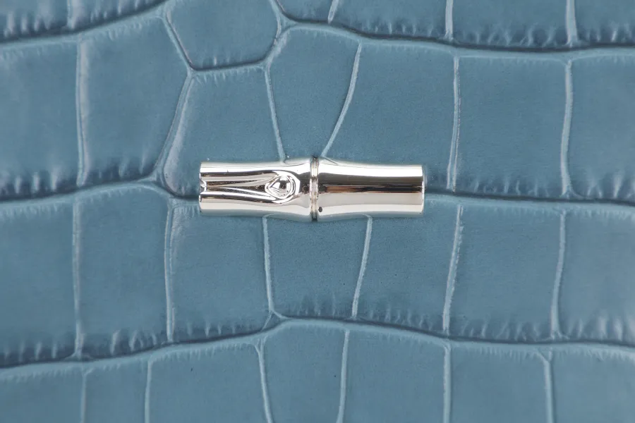 LONGCHAMP BLUE CROCO EMBOSSED WRISTLET WITH DUST COVER